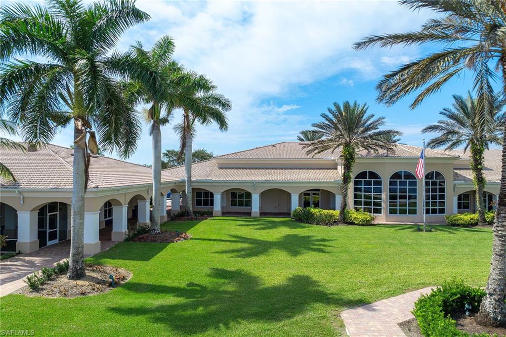 7534 Garibaldi Court Naples, FL 34114 - Photo 43 of 50 a front view of house with yard and green space