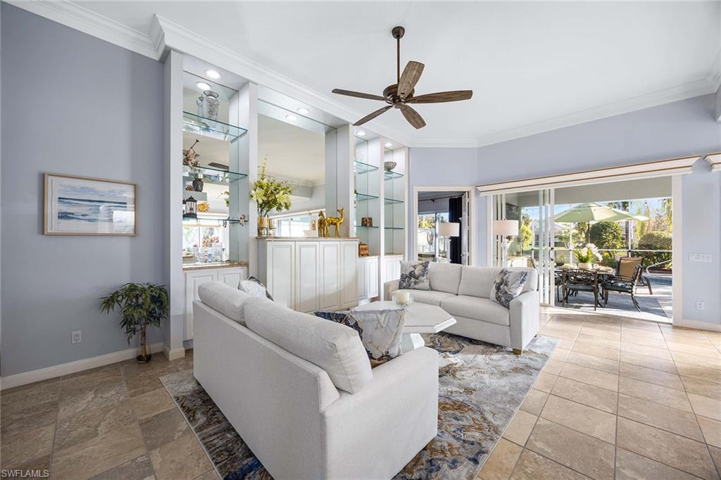 7534 Garibaldi Court Naples, FL 34114 - Photo 6 of 50 a living room with furniture and a large window
