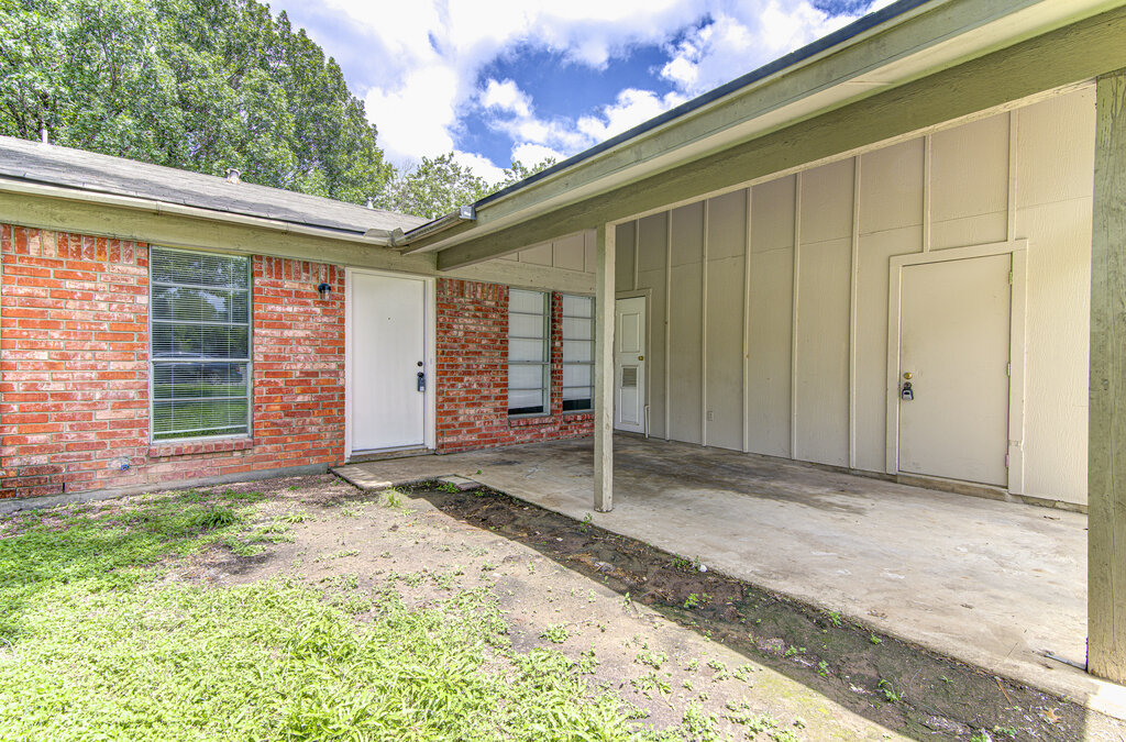 5301 Indio Circle, Unit A Austin, TX 78745 - Photo 3 of 25 A classic brick exterior offers enduring appeal with a covered walkway and convenient outdoor storage.