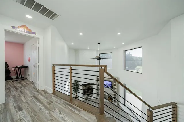 a view of a hallway with a kitchen