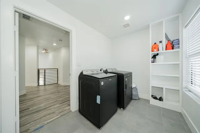 a view of a livingroom with furniture and cabinet