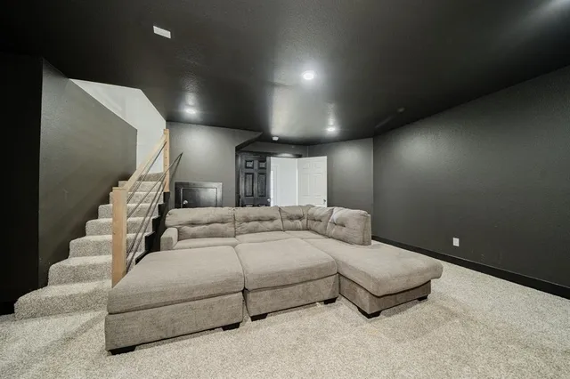 a spacious bedroom with a bed and a couch