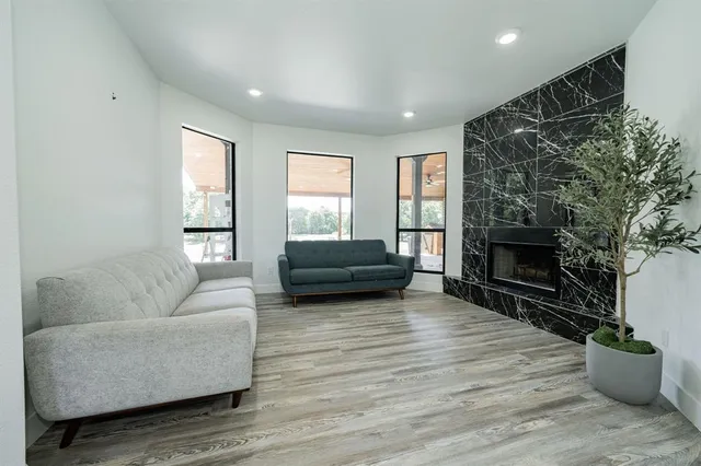 a living room with furniture and a fireplace