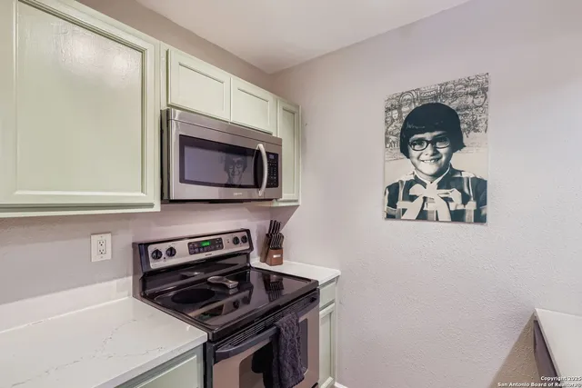 a kitchen with a stove and a microwave