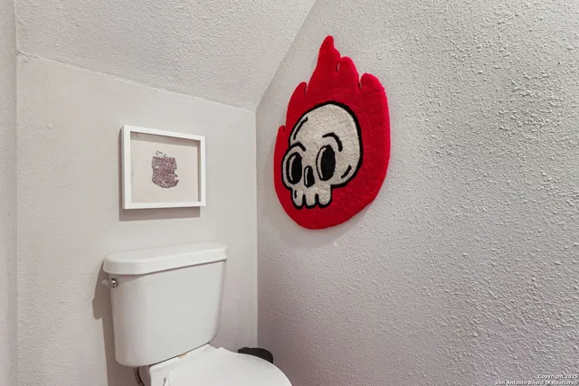 a bathroom with a toilet and a sink