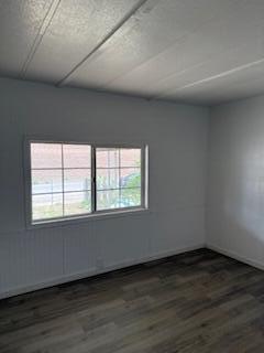 681 South Market Road Earlimart, CA 93219 - Photo 8 of 13 an empty room with wooden floor and windows