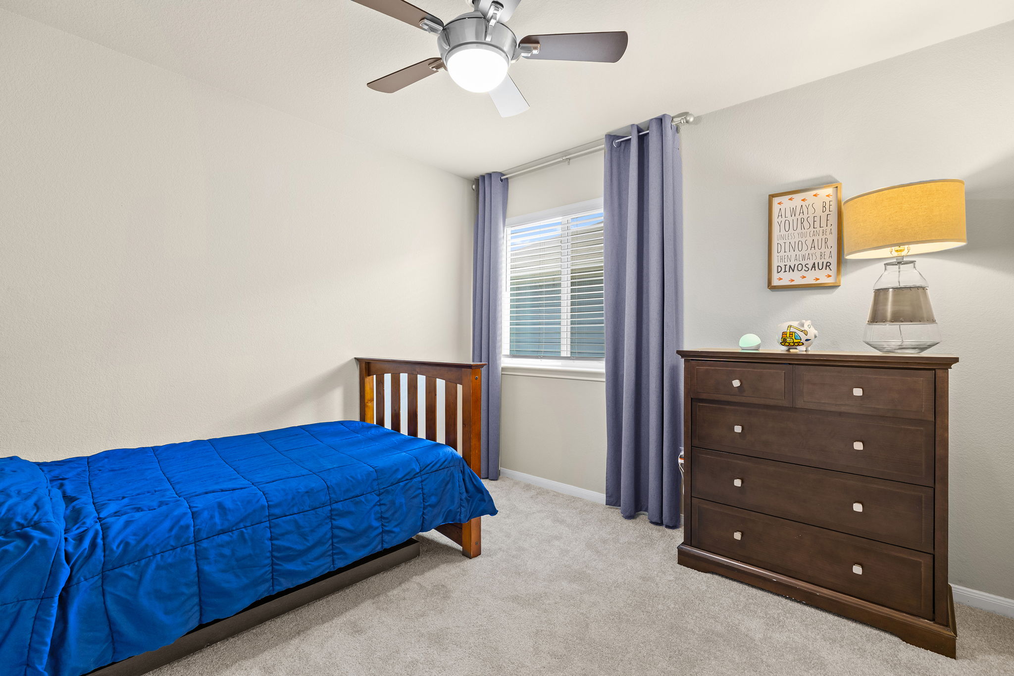404 Cassandra Drive Hutto, TX 78634 - Photo 24 of 40 Bedroom featuring light colored carpet and ceiling fan