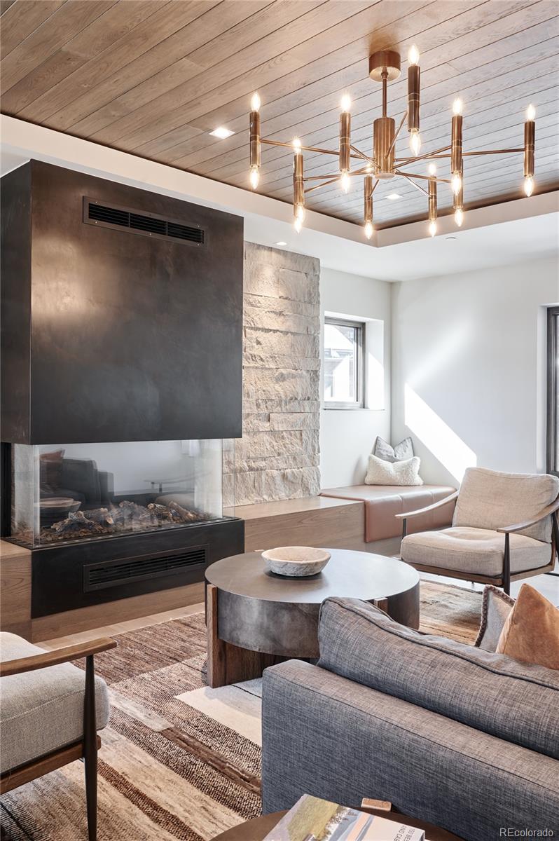 430 South Frontage Road East, Unit RUF Vail, CO 81657 - Photo 14 of 19 a living room with furniture and a flat screen tv