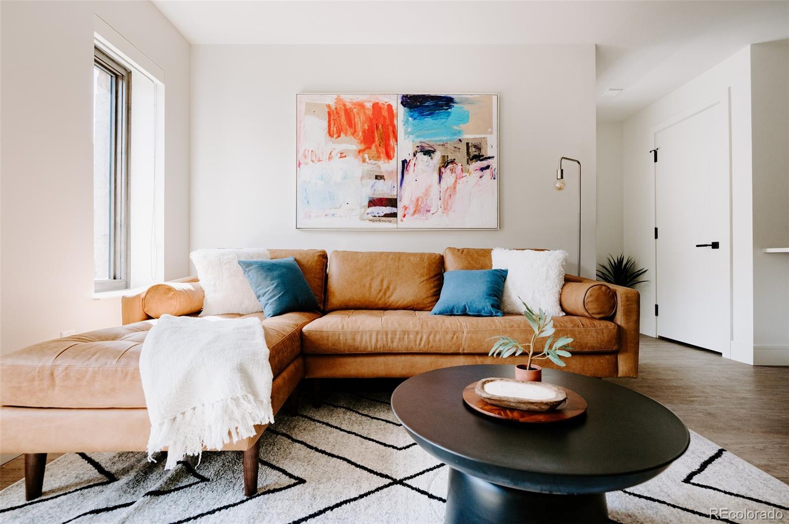 430 South Frontage Road East, Unit RUF Vail, CO 81657 - Photo 5 of 19 a living room with furniture and a lamp