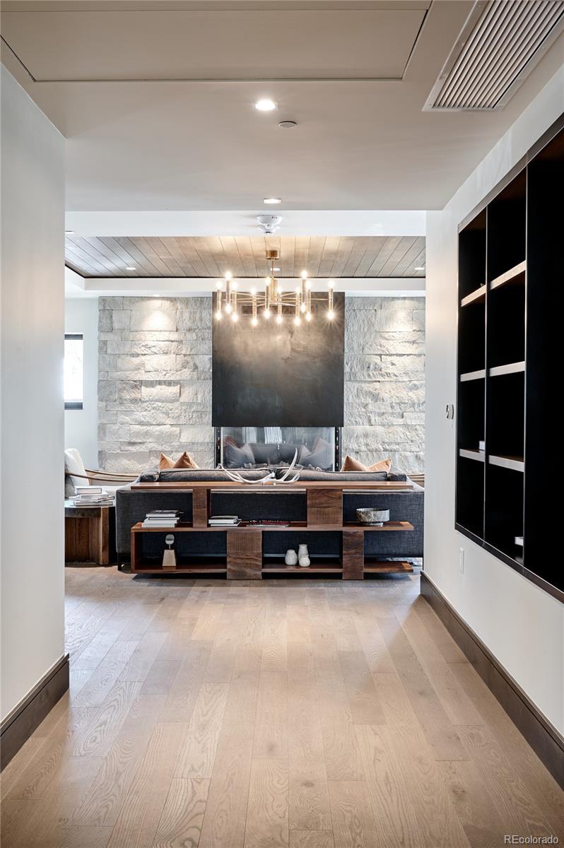 430 South Frontage Road East, Unit RUF Vail, CO 81657 - Photo 10 of 19 a living room with furniture and flat screen tv