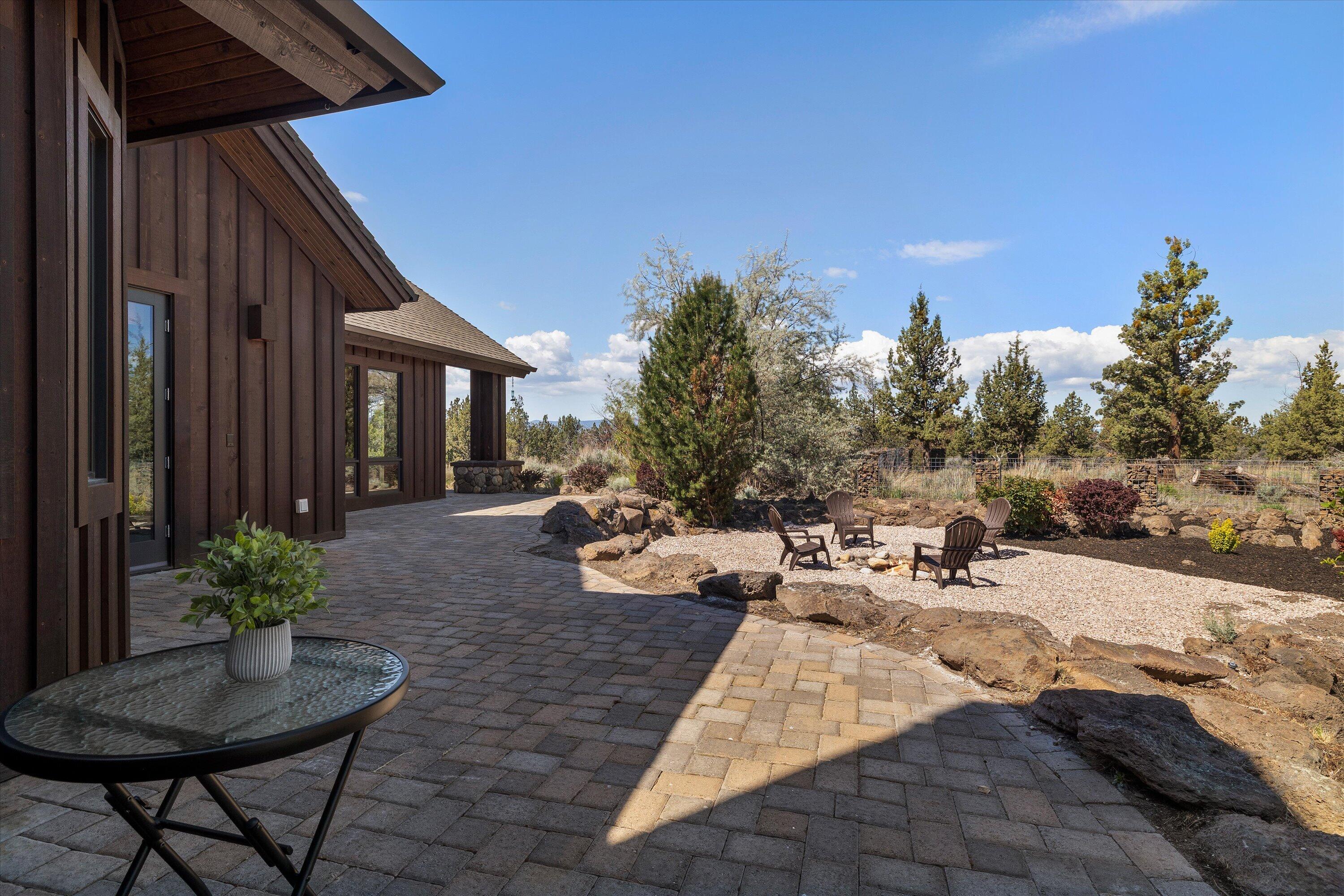 64155 Hunnell Road Bend, OR 97703 - Photo 43 of 96 A quiet spot to enjoy a good read overlooking the yard and firepit.