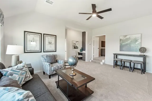 a living room with furniture and a table