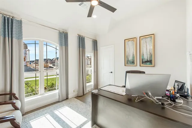 a room with gym equipment and windows