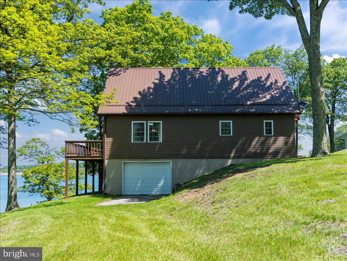 663 Bear Woods Road Mount Storm, WV 26739 - Photo 6 of 73 Charming lakeside retreat with greenery.