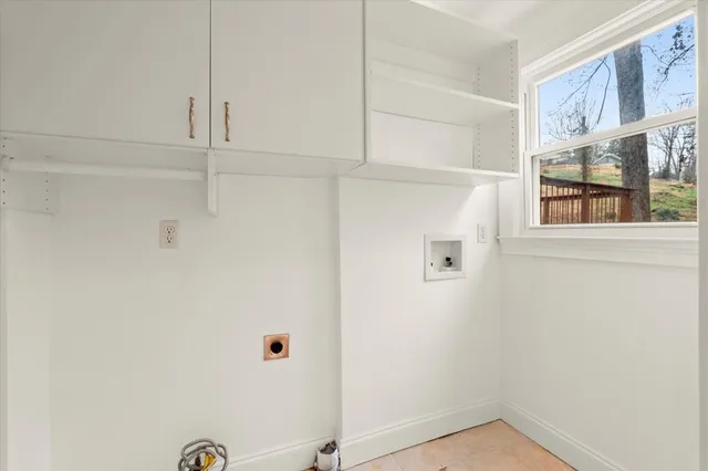 a view of sitting area with furniture and wooden floor