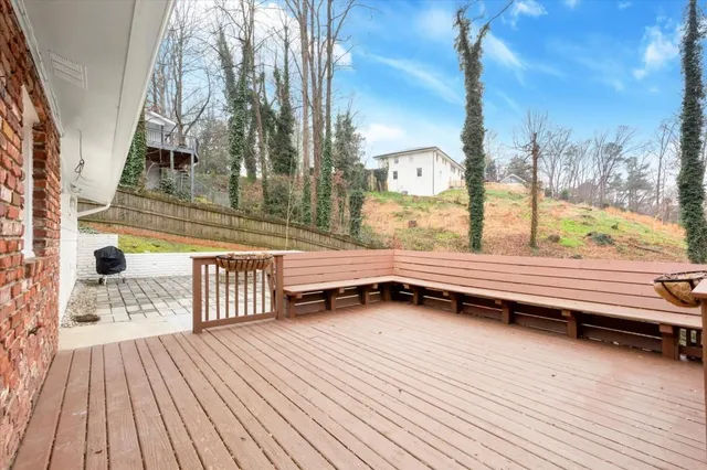 a view of a house with wooden deck