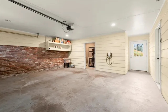 a view of a house with a yard covered in snow