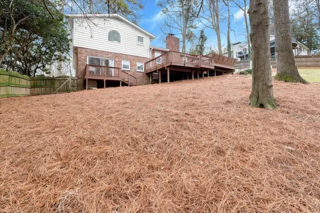 a view of house with yard