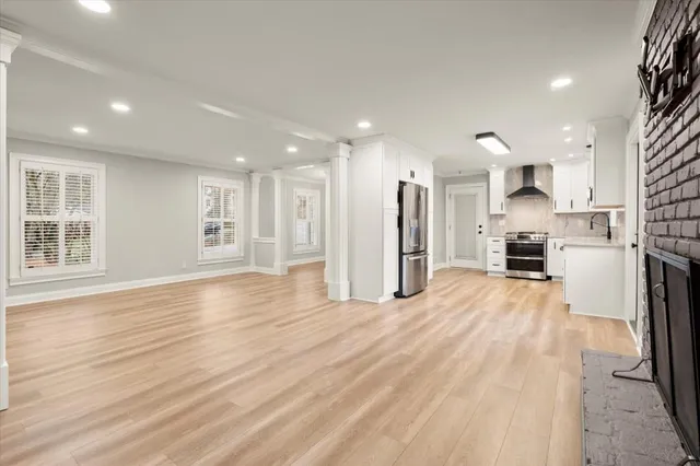 a view of a kitchen with a sink and a window