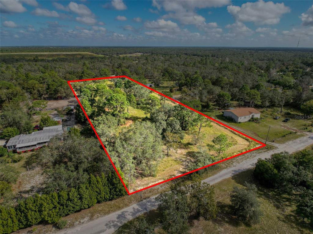 0 Smith Boulevard Hudson, FL 34667 - Photo 2 of 8 a view of a yard with an outdoor seating