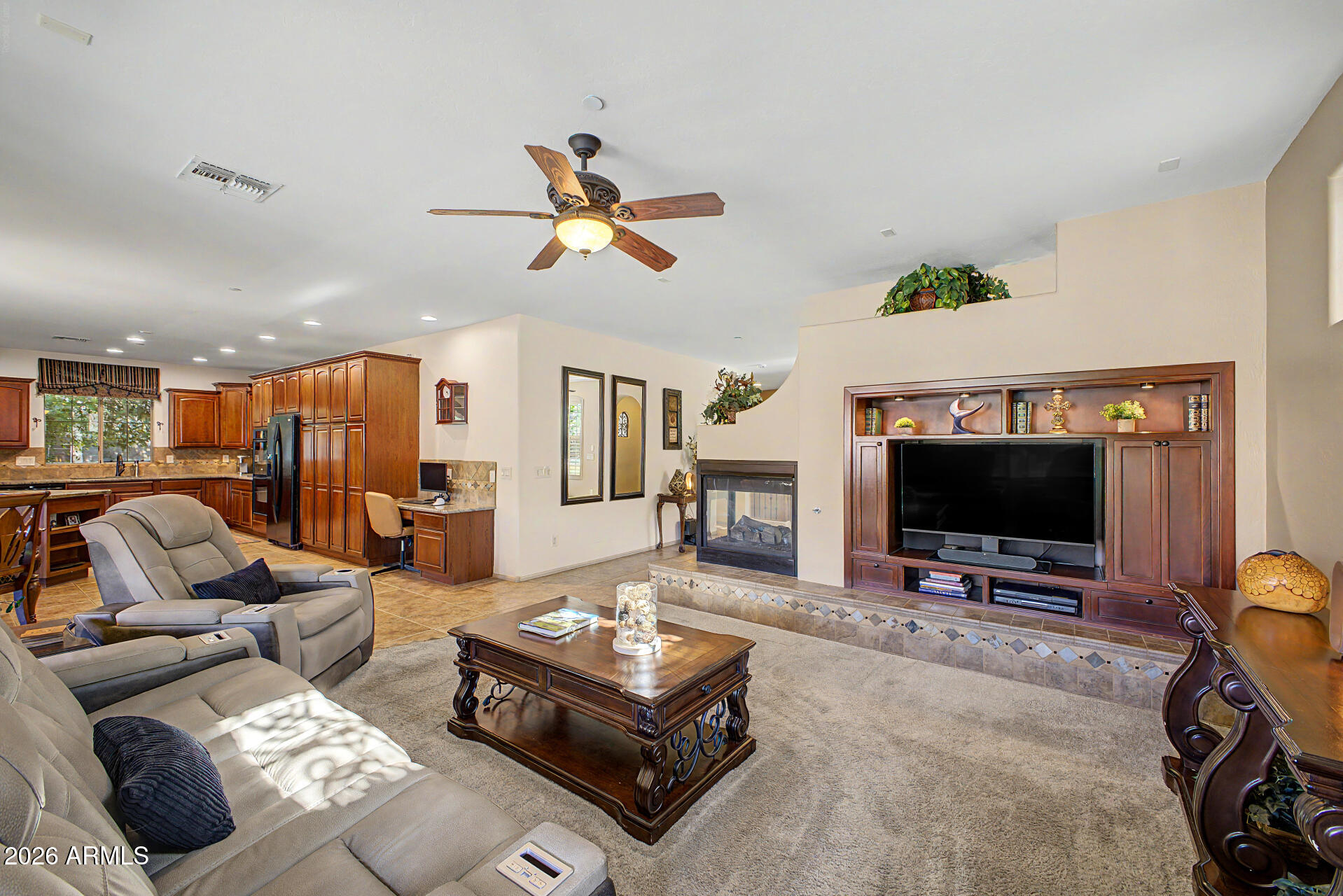 2996 East Agritopia Loop North Gilbert, AZ 85296 - Photo 8 of 73 a living room with furniture and a flat screen tv