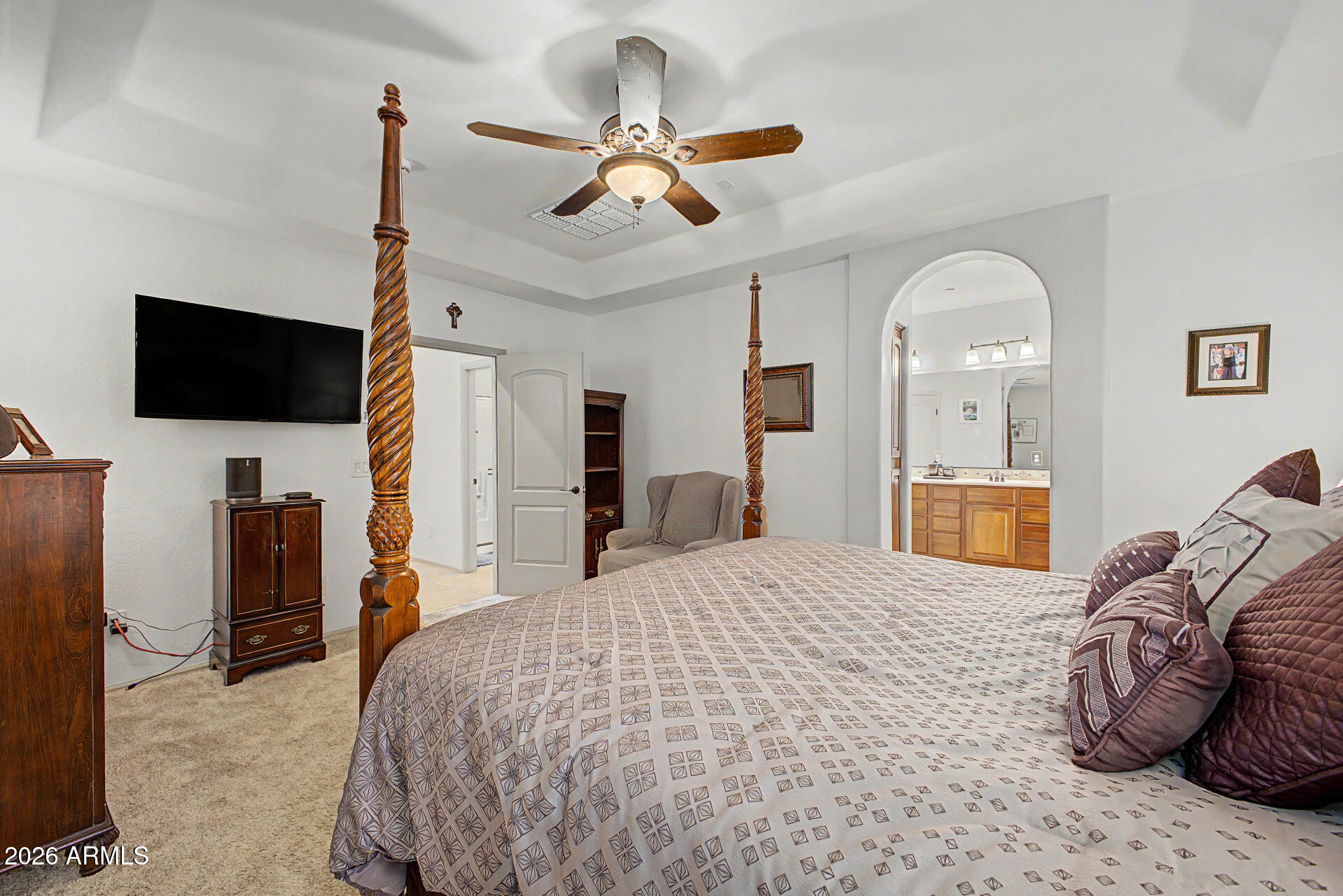 2996 East Agritopia Loop North Gilbert, AZ 85296 - Photo 15 of 73 a bedroom with a bed and a flat screen tv