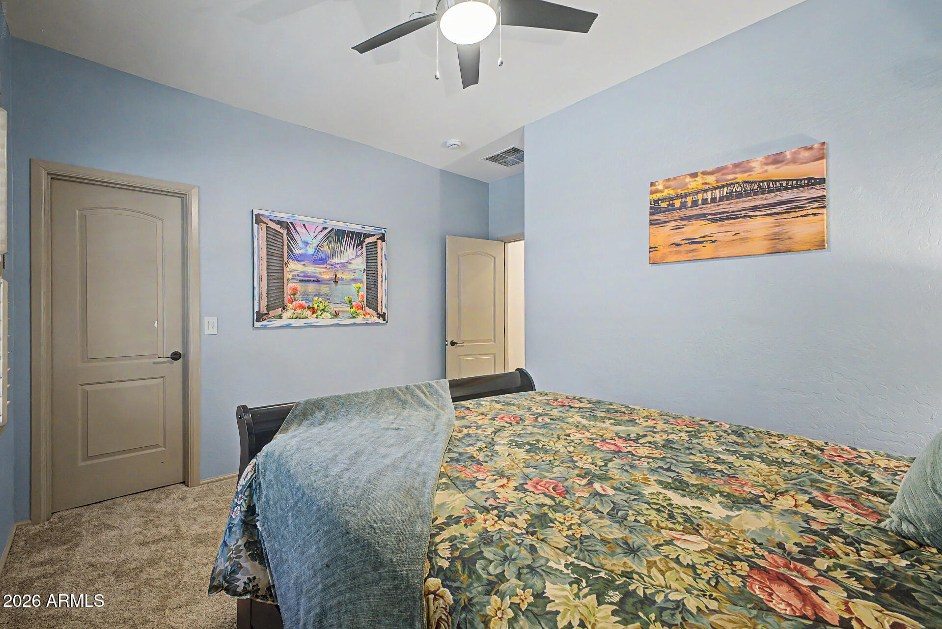 2996 East Agritopia Loop North Gilbert, AZ 85296 - Photo 20 of 73 a bedroom with bed and painting on the wall