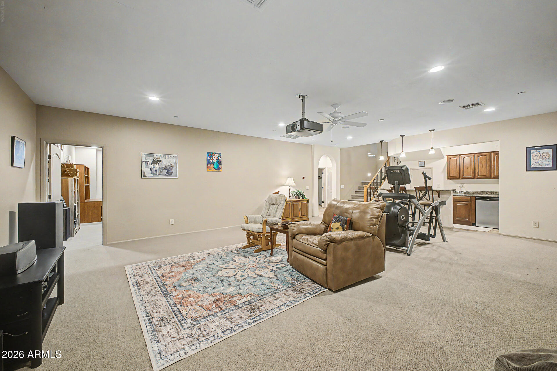 2996 East Agritopia Loop North Gilbert, AZ 85296 - Photo 30 of 73 a living room with furniture and a table