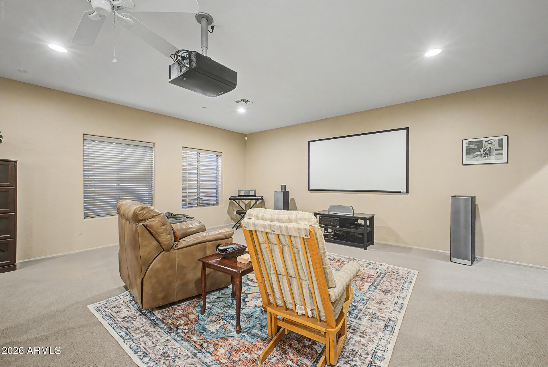 2996 East Agritopia Loop North Gilbert, AZ 85296 - Photo 31 of 73 a living room with furniture and a flat screen tv