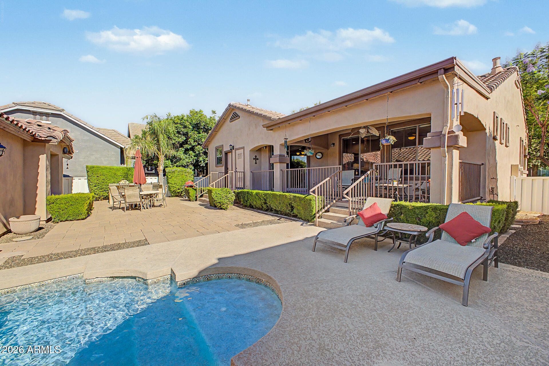 2996 East Agritopia Loop North Gilbert, AZ 85296 - Photo 44 of 73 a view of a house with backyard and sitting area