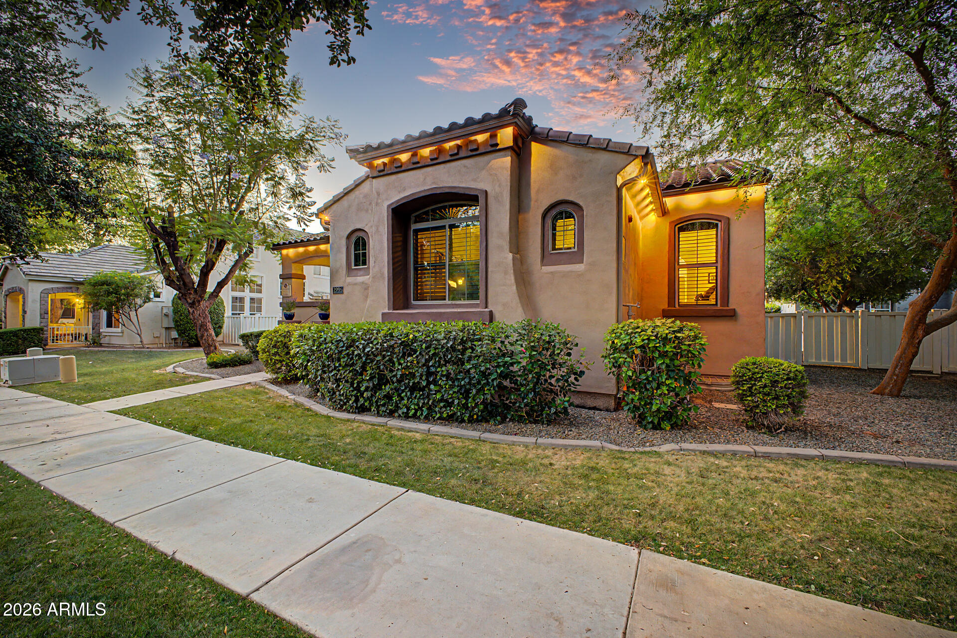 2996 East Agritopia Loop North Gilbert, AZ 85296 - Photo 3 of 73 a front view of a house with a yard