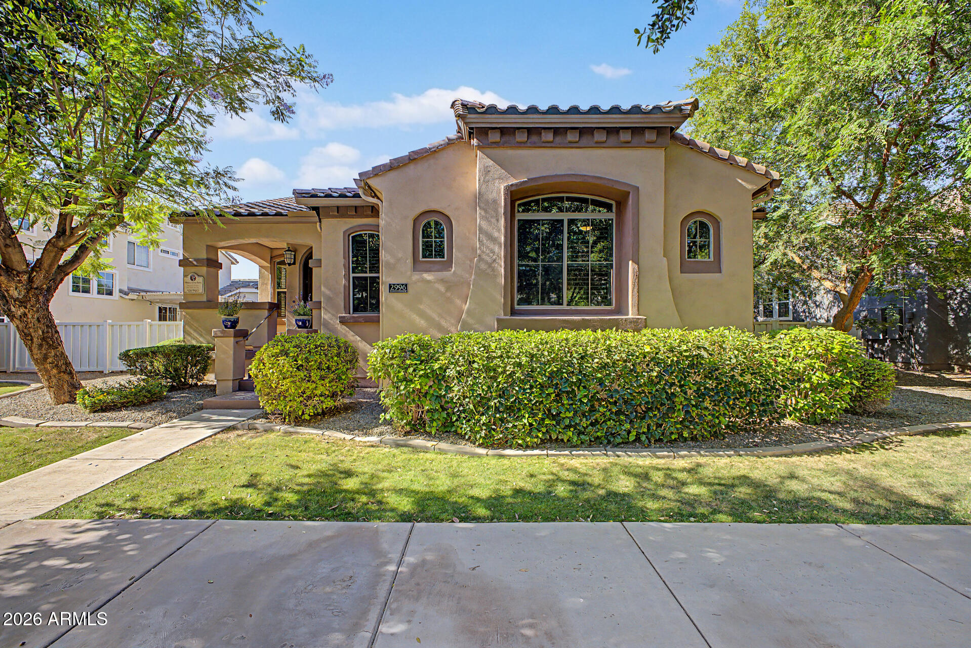 2996 East Agritopia Loop North Gilbert, AZ 85296 - Photo 51 of 73 a front view of a house with a yard