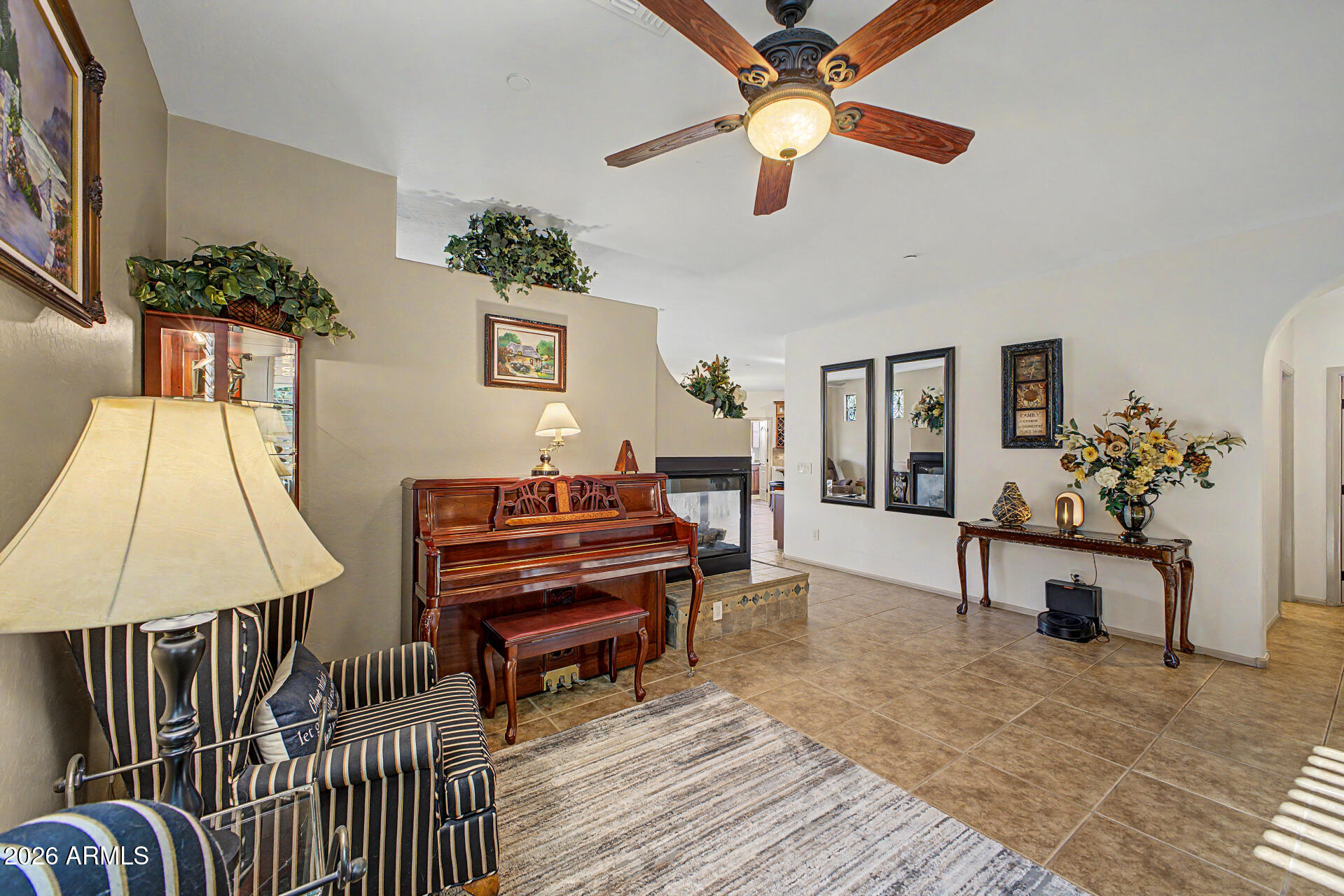 2996 East Agritopia Loop North Gilbert, AZ 85296 - Photo 5 of 73 a living room with furniture and a chandelier