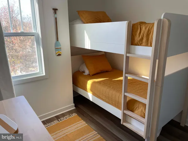 a bed room with a bed and a window