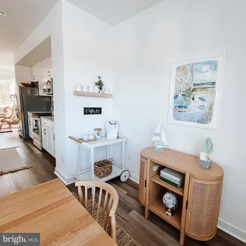 a room with furniture and view kitchen