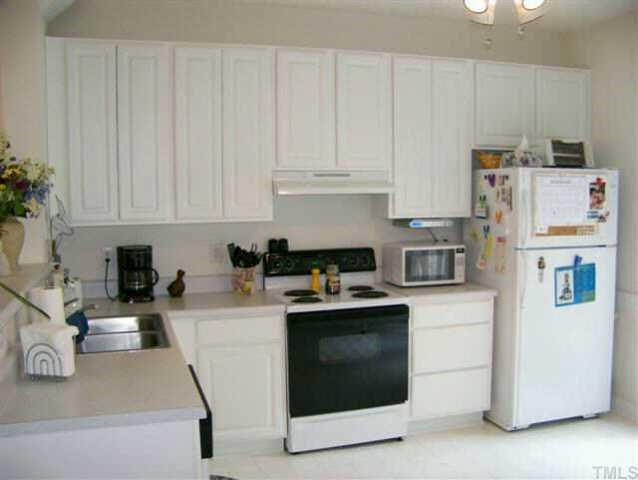 7327 Bonnie Ridge Court Raleigh, NC 27615 - Photo 4 of 10 Cook up some great meals in this light and bright kitchen. French doors lead to the fabulous patio area outside. Other