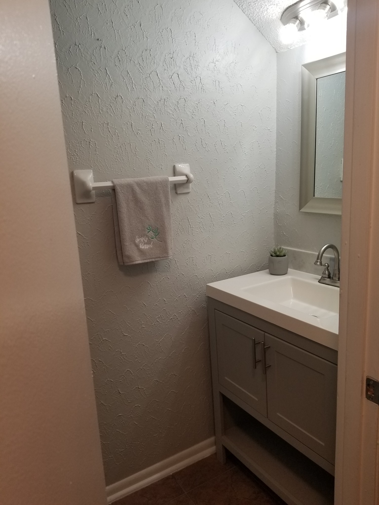 323 Forest Park Road, Unit 516 Madison, TN 37115 - Photo 11 of 12 a bathroom with a sink and mirror