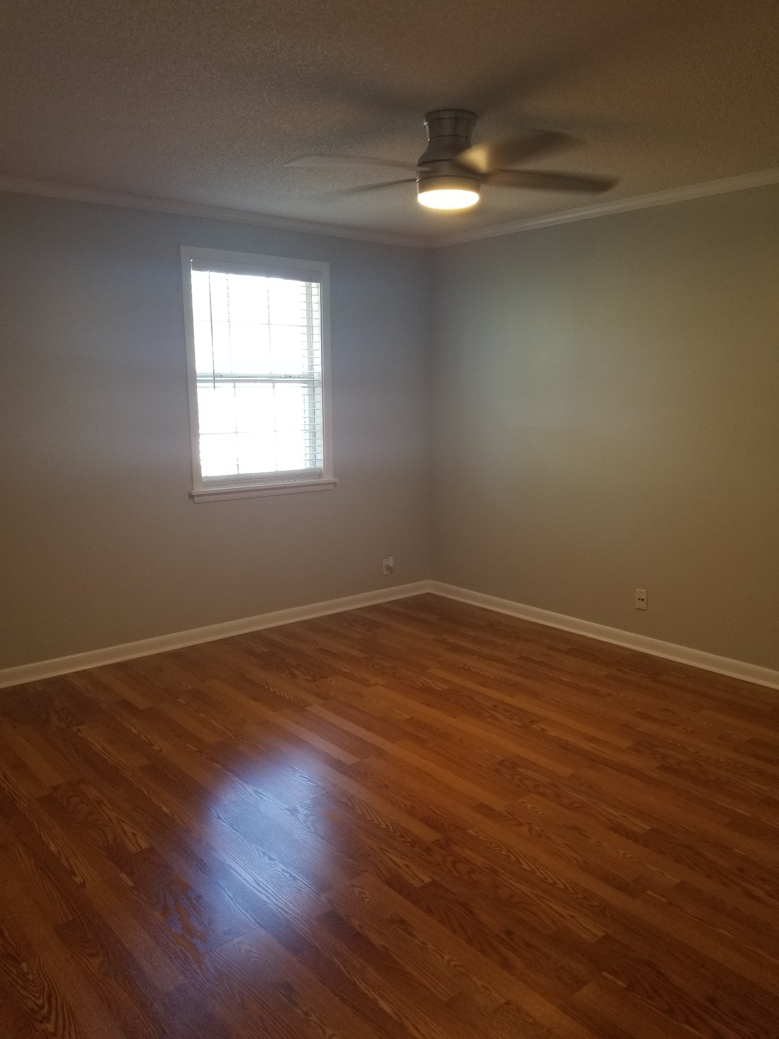 323 Forest Park Road, Unit 516 Madison, TN 37115 - Photo 4 of 12 wooden floor in an empty room with a window