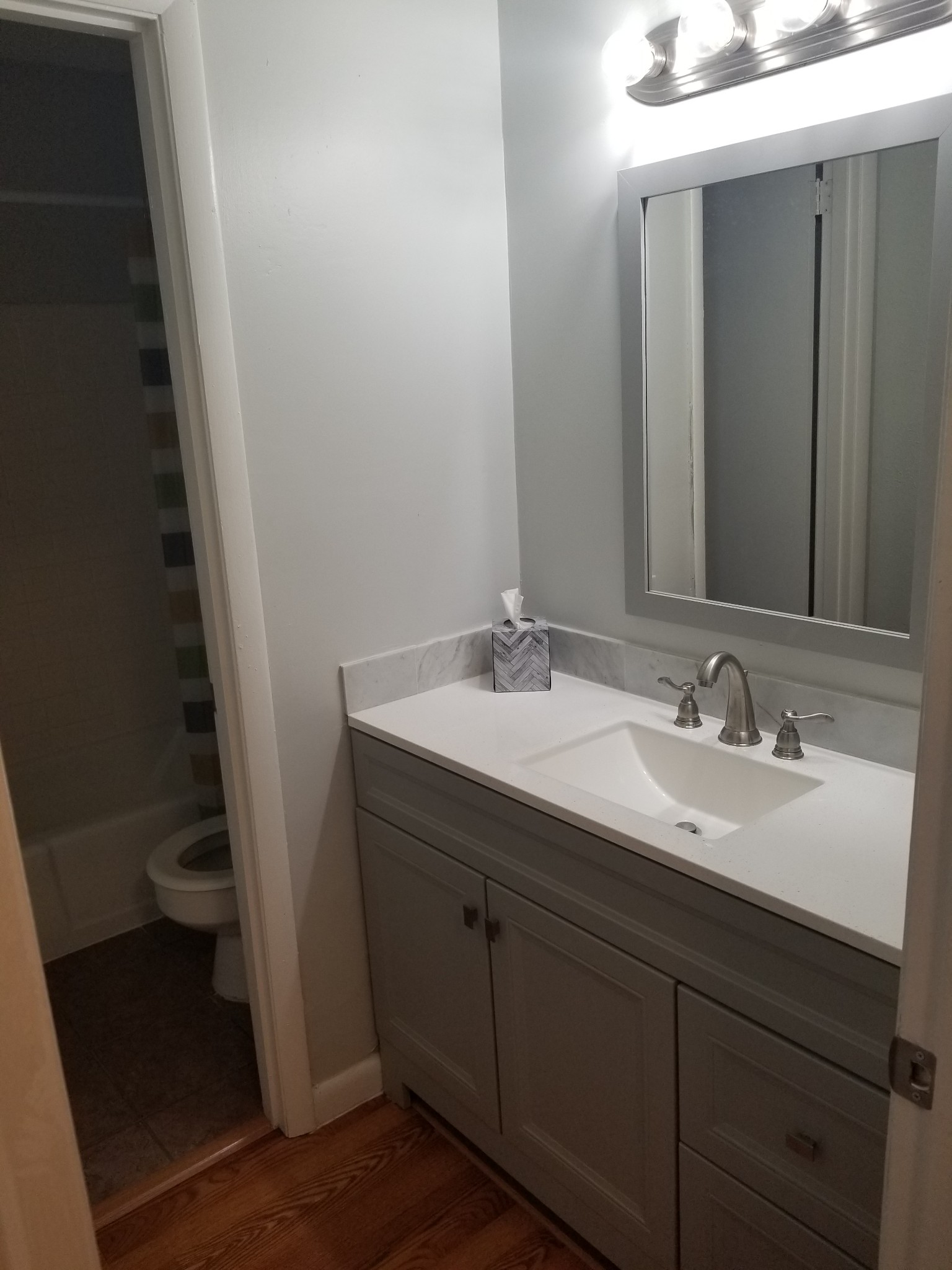 323 Forest Park Road, Unit 516 Madison, TN 37115 - Photo 7 of 12 a bathroom with a sink and a mirror