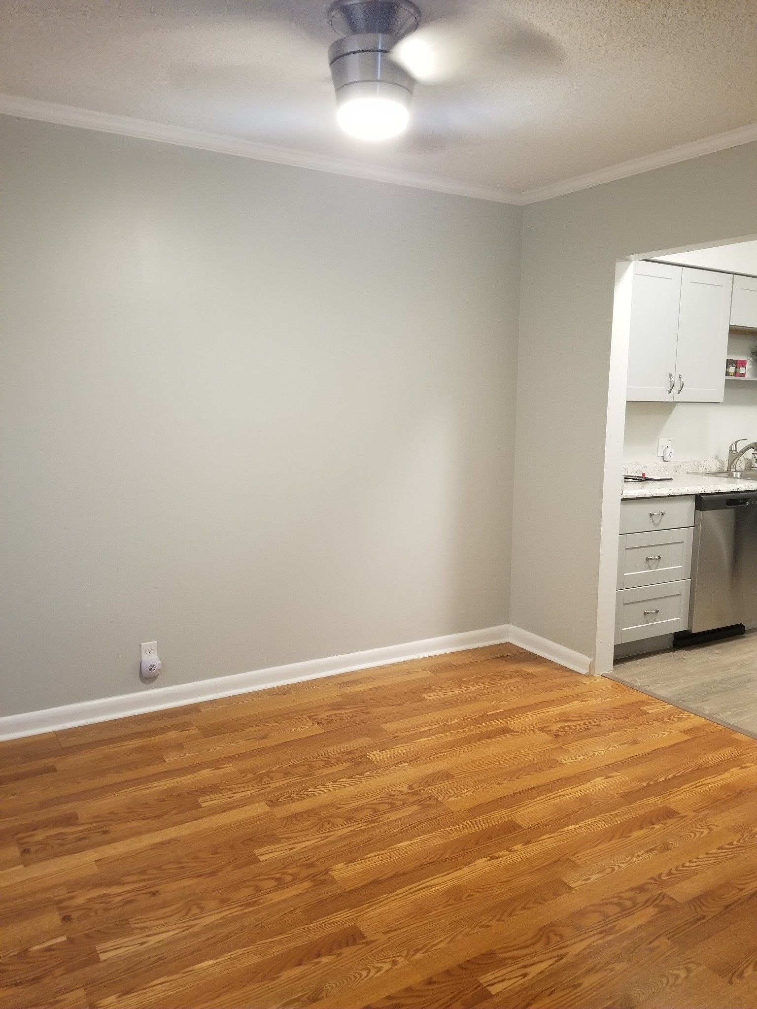 323 Forest Park Road, Unit 516 Madison, TN 37115 - Photo 9 of 12 a view of an empty room with window and wooden floor
