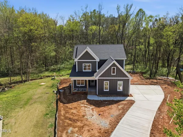 a house with trees in the background
