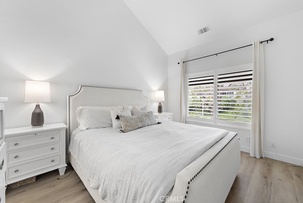 12 Bright Water Drive Dana Point, CA 92629 - Photo 11 of 24 a bedroom with a bed and a night stand