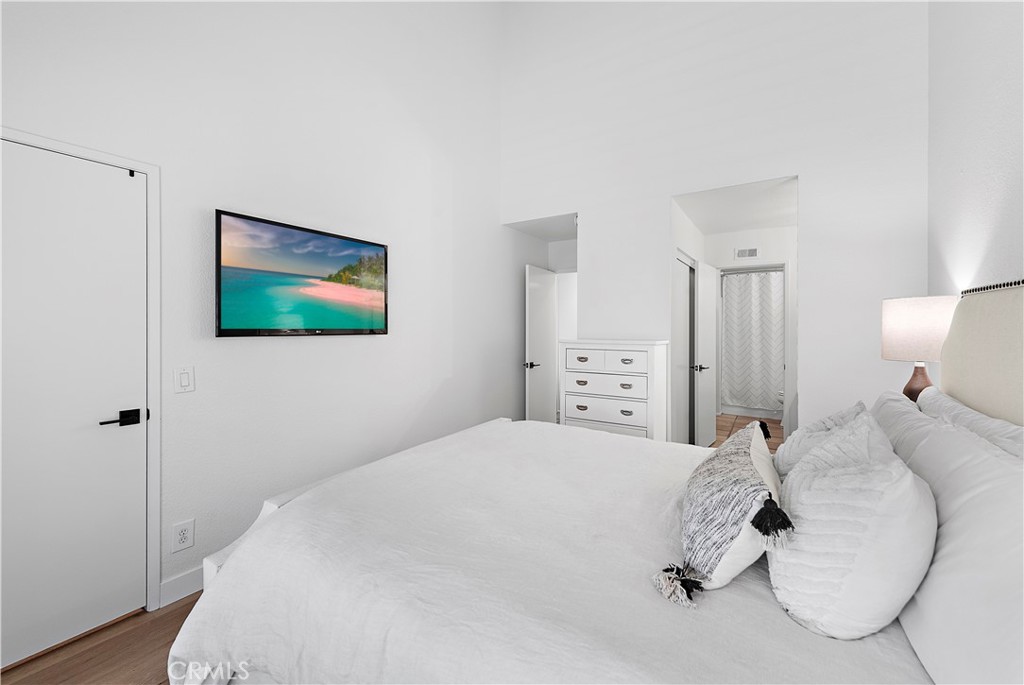 12 Bright Water Drive Dana Point, CA 92629 - Photo 12 of 24 a bedroom with a bed and a painting on the wall