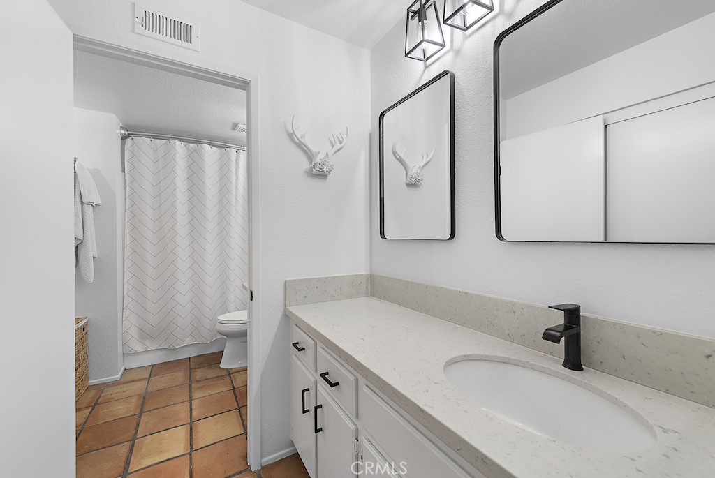 12 Bright Water Drive Dana Point, CA 92629 - Photo 13 of 24 a bathroom with a sink toilet and shower