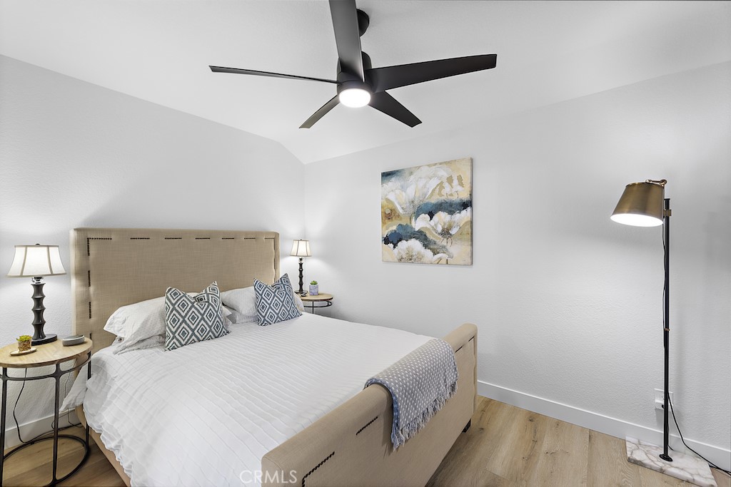 12 Bright Water Drive Dana Point, CA 92629 - Photo 16 of 24 a bedroom with a bed and a chandelier