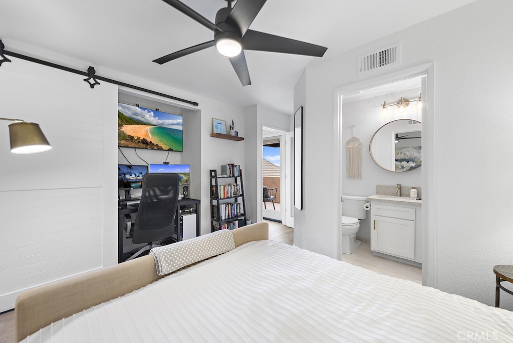 12 Bright Water Drive Dana Point, CA 92629 - Photo 17 of 24 a bedroom with a bed and a chandelier