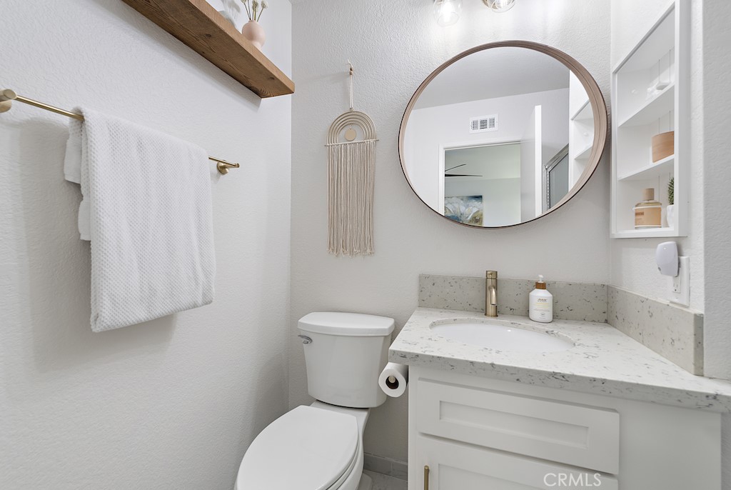 12 Bright Water Drive Dana Point, CA 92629 - Photo 18 of 24 a bathroom with a toilet a sink and a mirror
