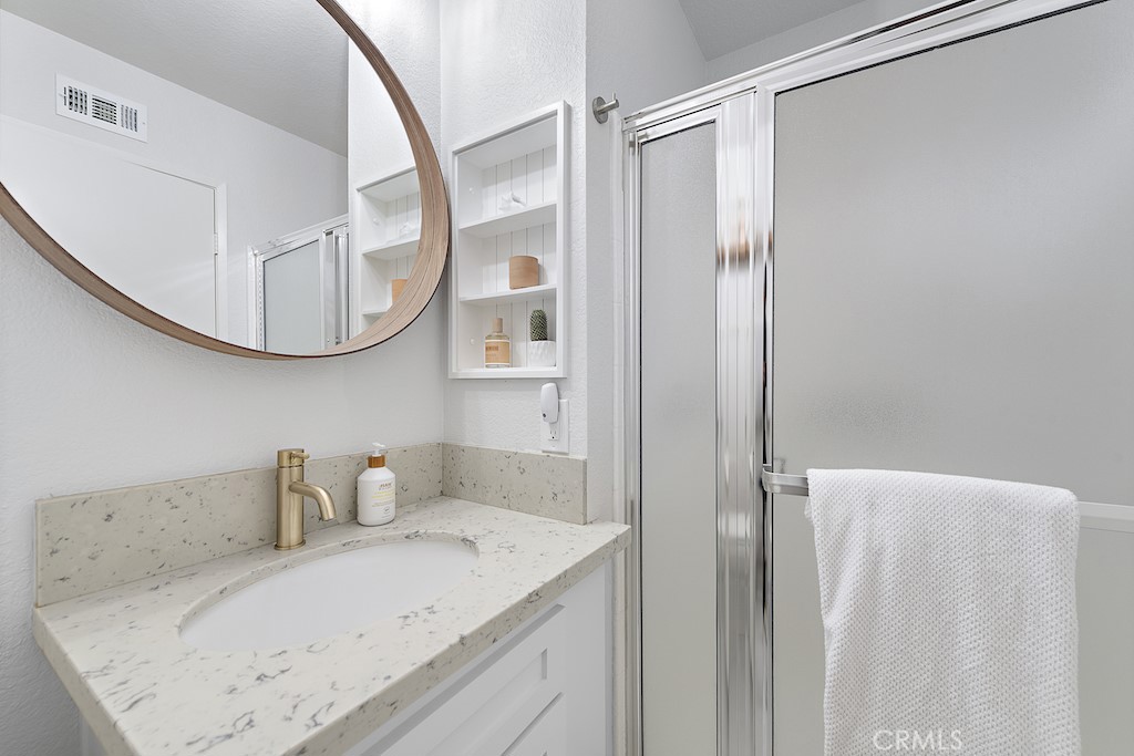 12 Bright Water Drive Dana Point, CA 92629 - Photo 19 of 24 a bathroom with a granite countertop sink and a mirror