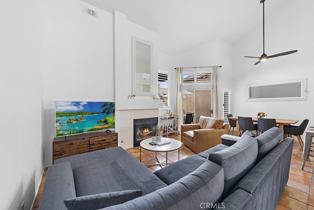 12 Bright Water Drive Dana Point, CA 92629 - Photo 3 of 24 a living room with furniture fireplace and a flat screen tv
