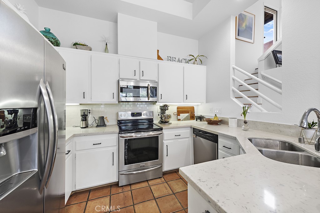 12 Bright Water Drive Dana Point, CA 92629 - Photo 8 of 24 a kitchen with cabinets a sink and stainless steel appliances